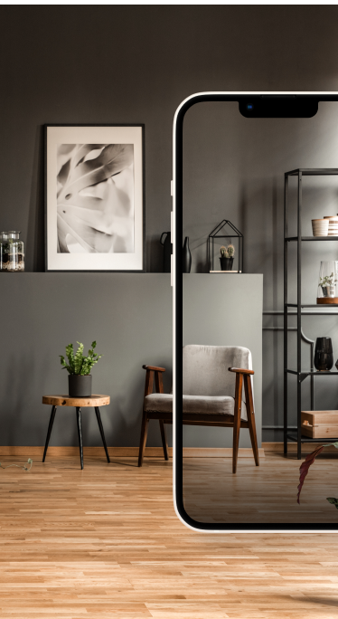 a woman on her phone shopping online at Dick Stark Carpet One for flooring.